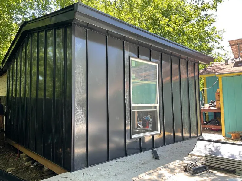 Black standing seam metal wall panels for Roof Inspection in Geneva